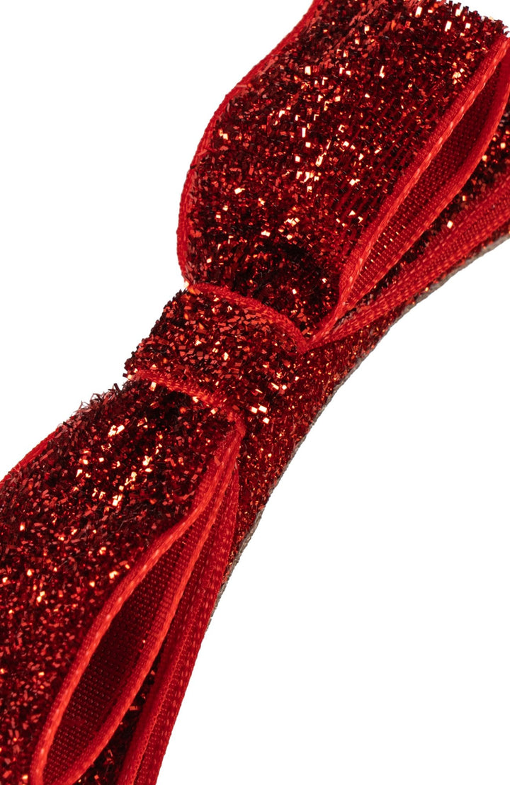 Närbild på Velvet Bow-diademets glittriga sammetsrosett