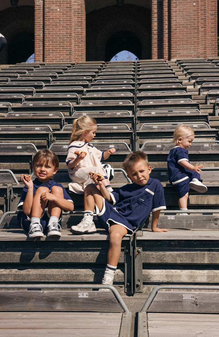 League Romper - Navy Poppedi Romper